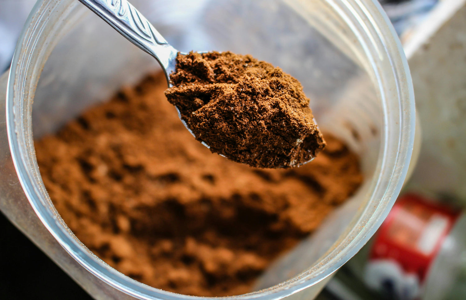 brown-powder-on-spoon-from-jar